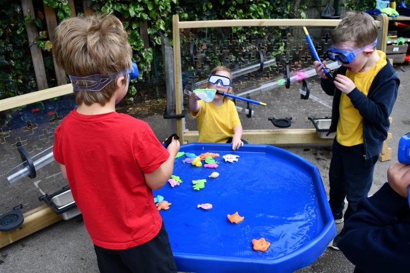 children stand and play with the buttermere water play package