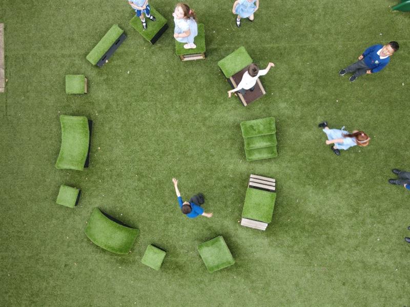 birdseye view of the get set, go blocks as the children play on the artificial grass beneath