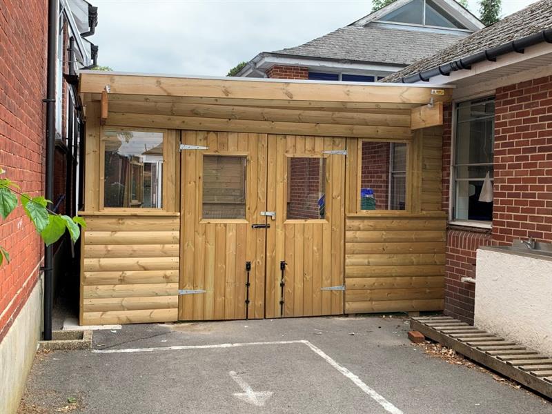 the outdoor of the food bank that is also a bespoke timber canopy acting as an outdoor classroom