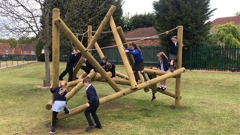 lots of children playing on our Bowfell climbing frame 