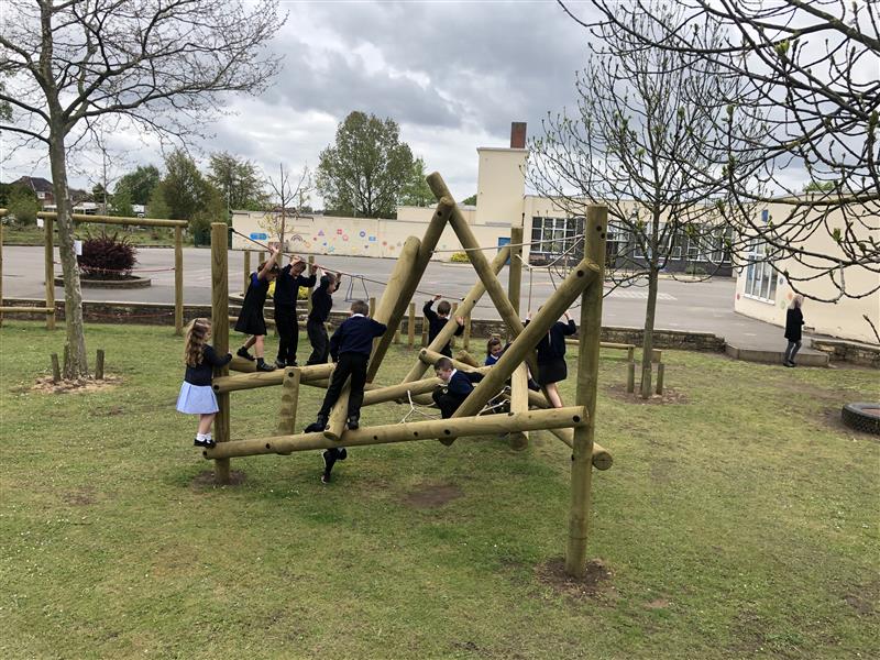 lots of children playing on our bowfell climbing frame 
