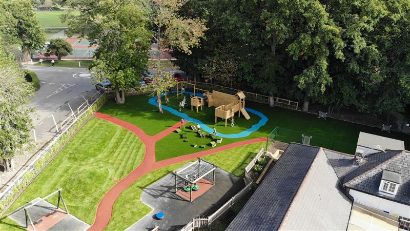 A birds eye view of the new playground development wit children playing on it