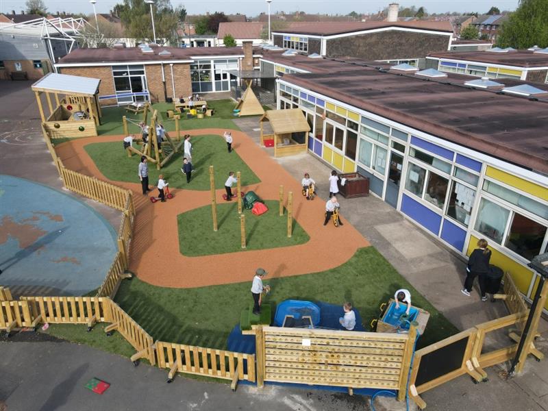 the eyfs play area is split into two with interactive fence panels on wheels