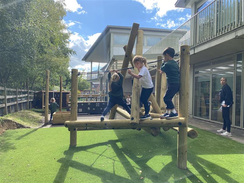 children build their coordination as they climb all over the timber climber