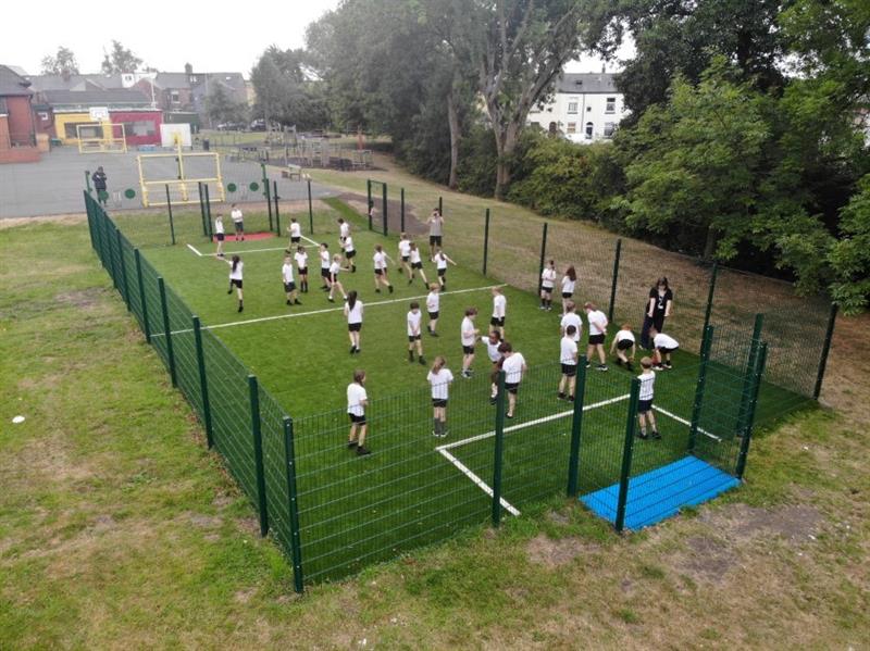a birdseye view of the muga with a blue goal end