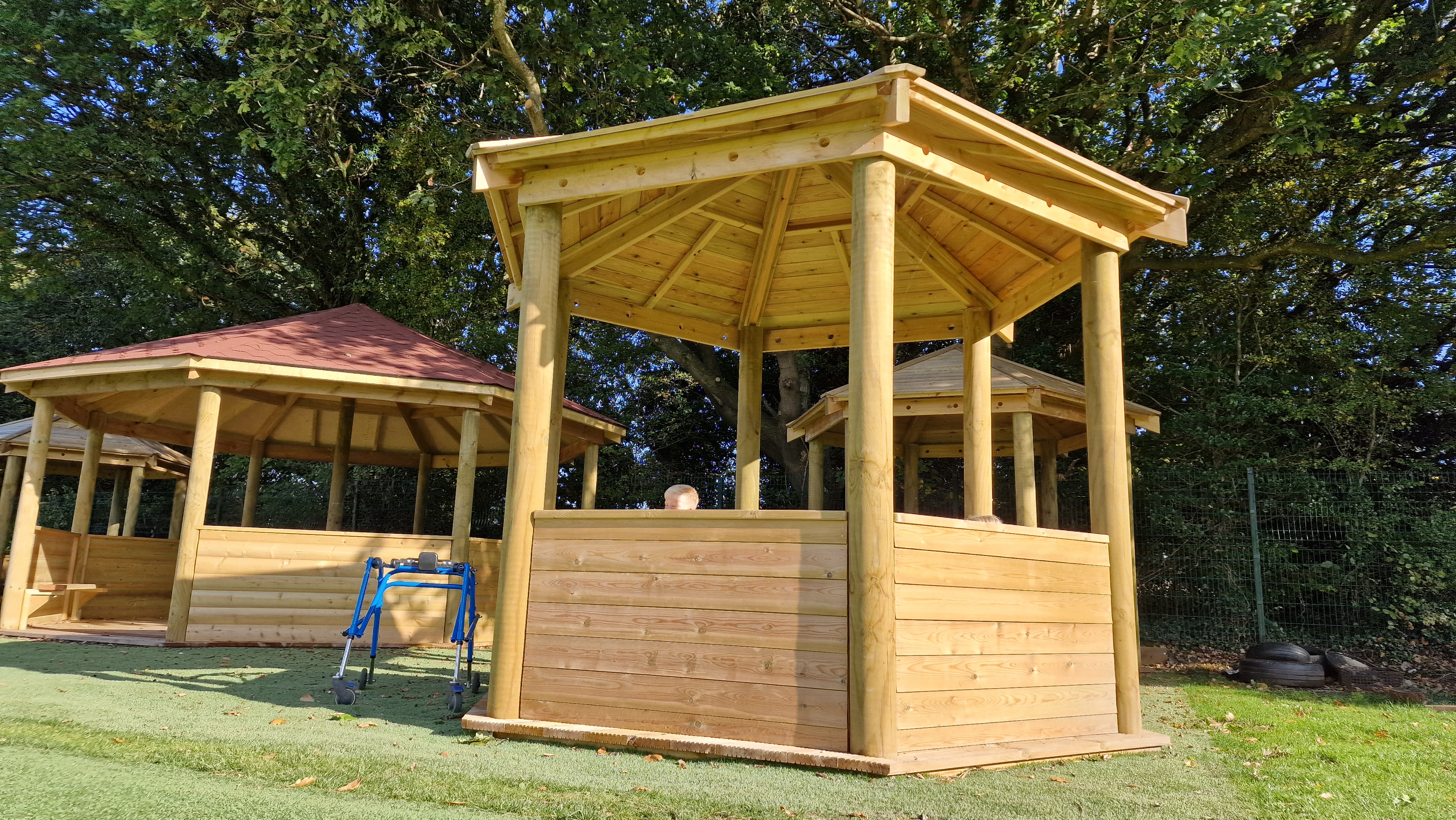 A side view of the smaller gazebo in a primary school setting