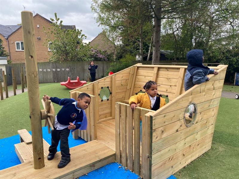 children stand on the various levels of the playship and look around at their environment