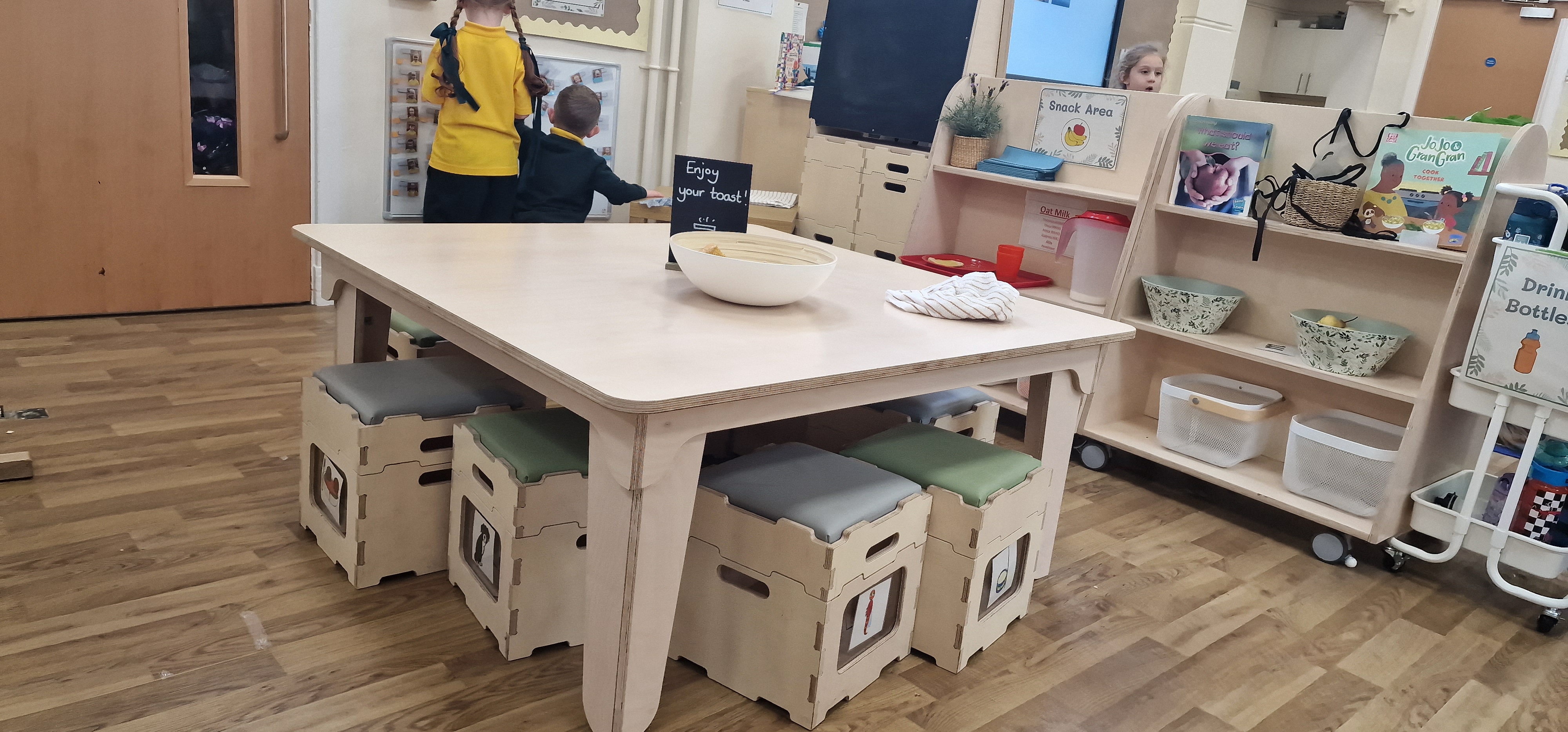 An image showing our square activity table and 4 stack and sit stools within Our Lady's Bishop Eton Primary School