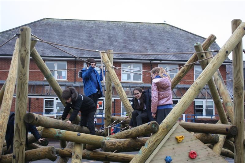 Children playing on pentagon plays biggest climbing frame ever, the crinkle crags climber, that has been installed onto artificial grass surfacing