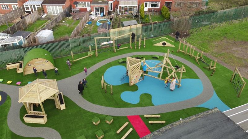 An eyfs playground that has been zoned into different areas of learning