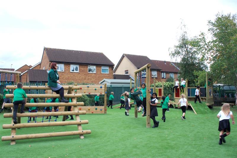 Bowsland Primary School's adventure playground full of children playing.