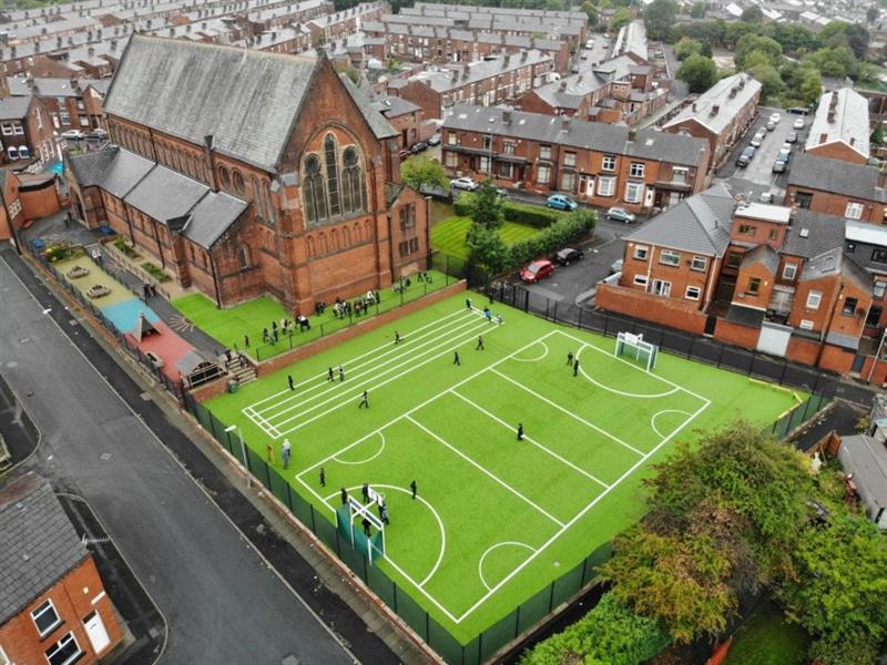 fox hollies school above the ground with their MUGA and daily mile track