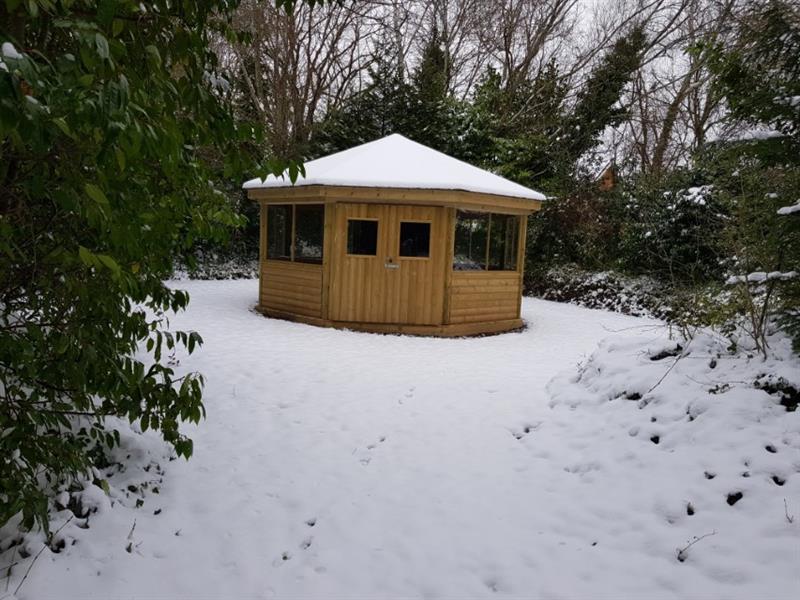 A picture of an outdoor classroom with snow ontop.