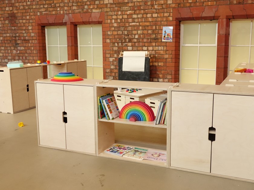 An indoor learning environment created by a variety of Pentagon Play classroom furniture items.