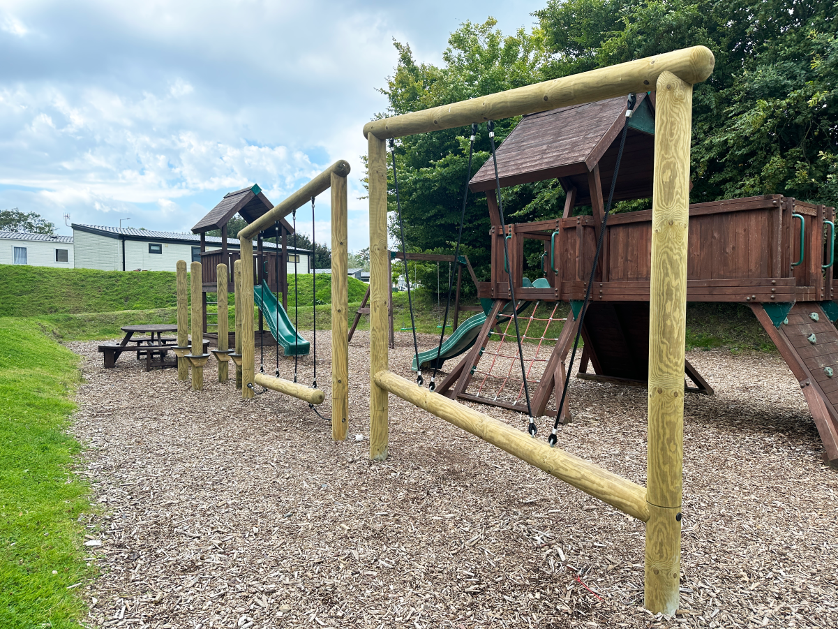 A picture showing the play area we created for Borwick Lakes. It includes trim trails and a play tower