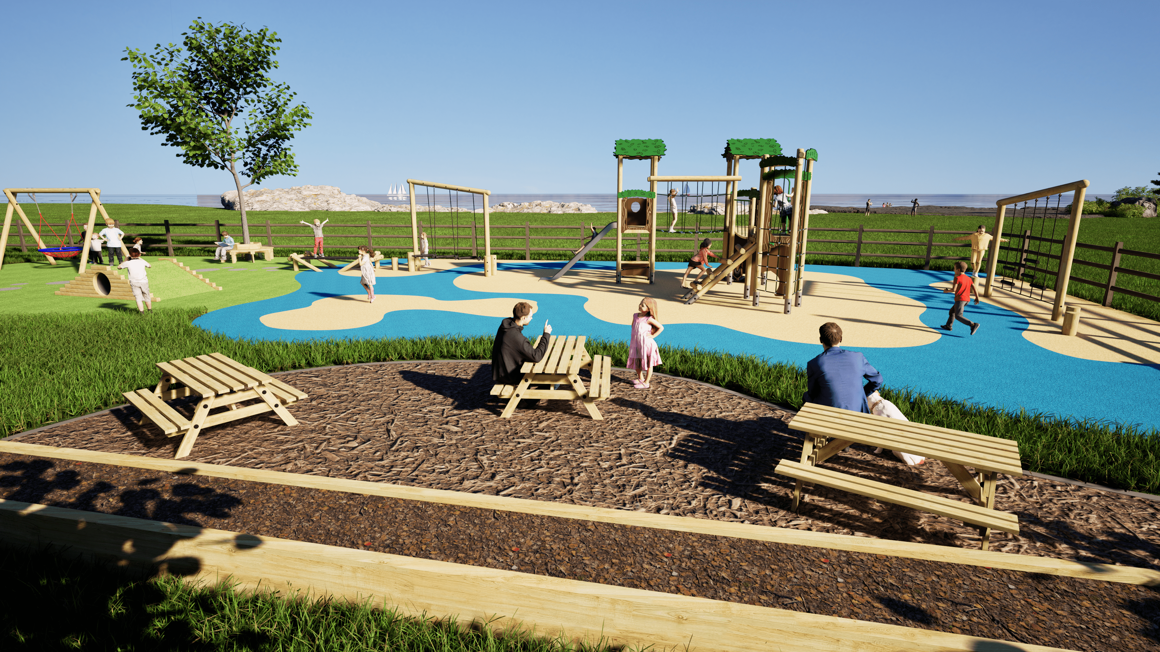 A play area at a Holiday Park that has the Hawk Play Tower Installed on it. Wetpour and artificial grass surfacing have been used to create a vibrant playground, with a seating area placed beside it with benches and people sat on them.