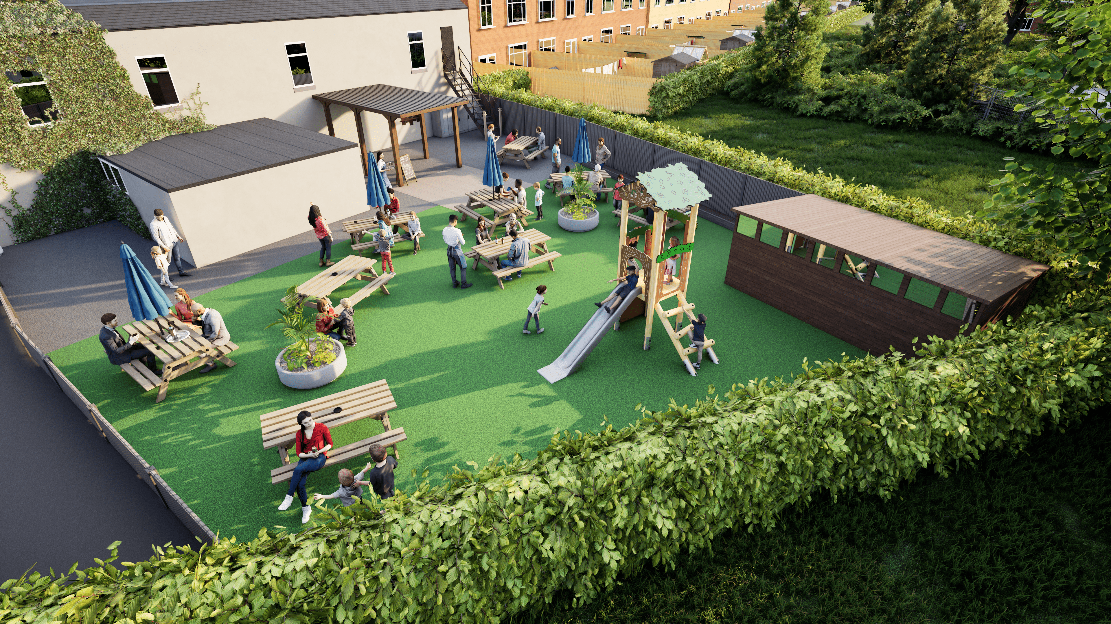 A Kestrel Play Tower that has been installed on a small play area next to a cafe. The play area has picnic benches scattered around the playground.