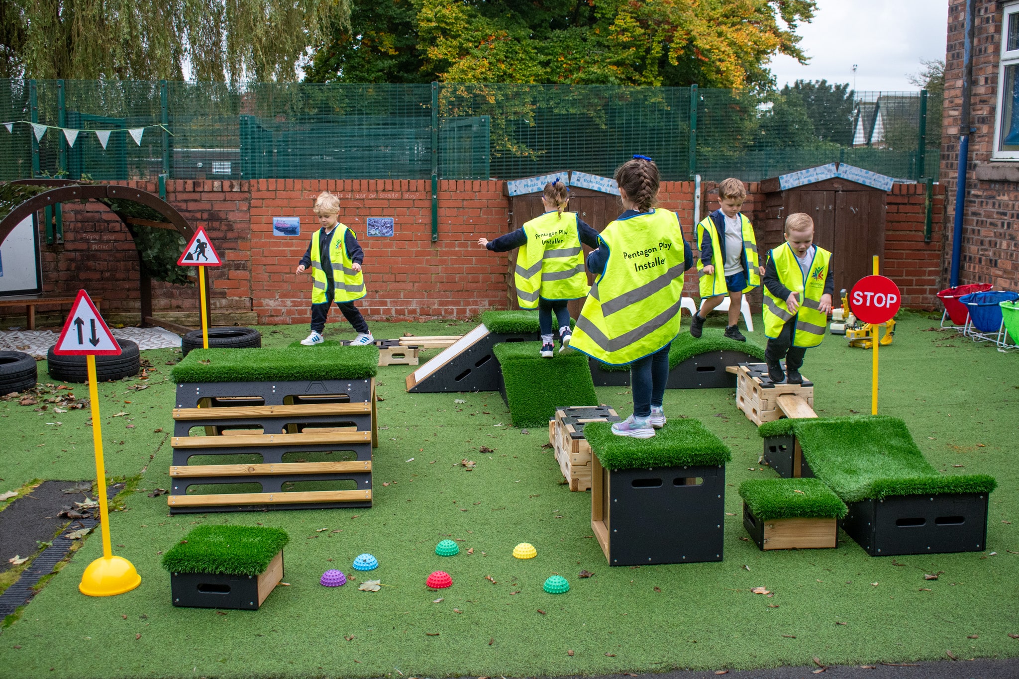 A group of children are navigating themselves around an obstacle course that they have created with the Sports Premium Explorer Package