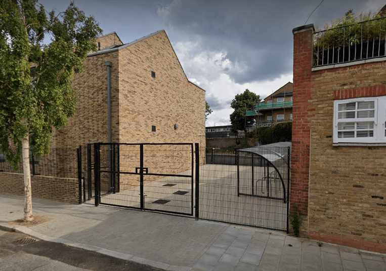 An outside photo of Sudbourne Primary School, showcasing the building and the entrance.