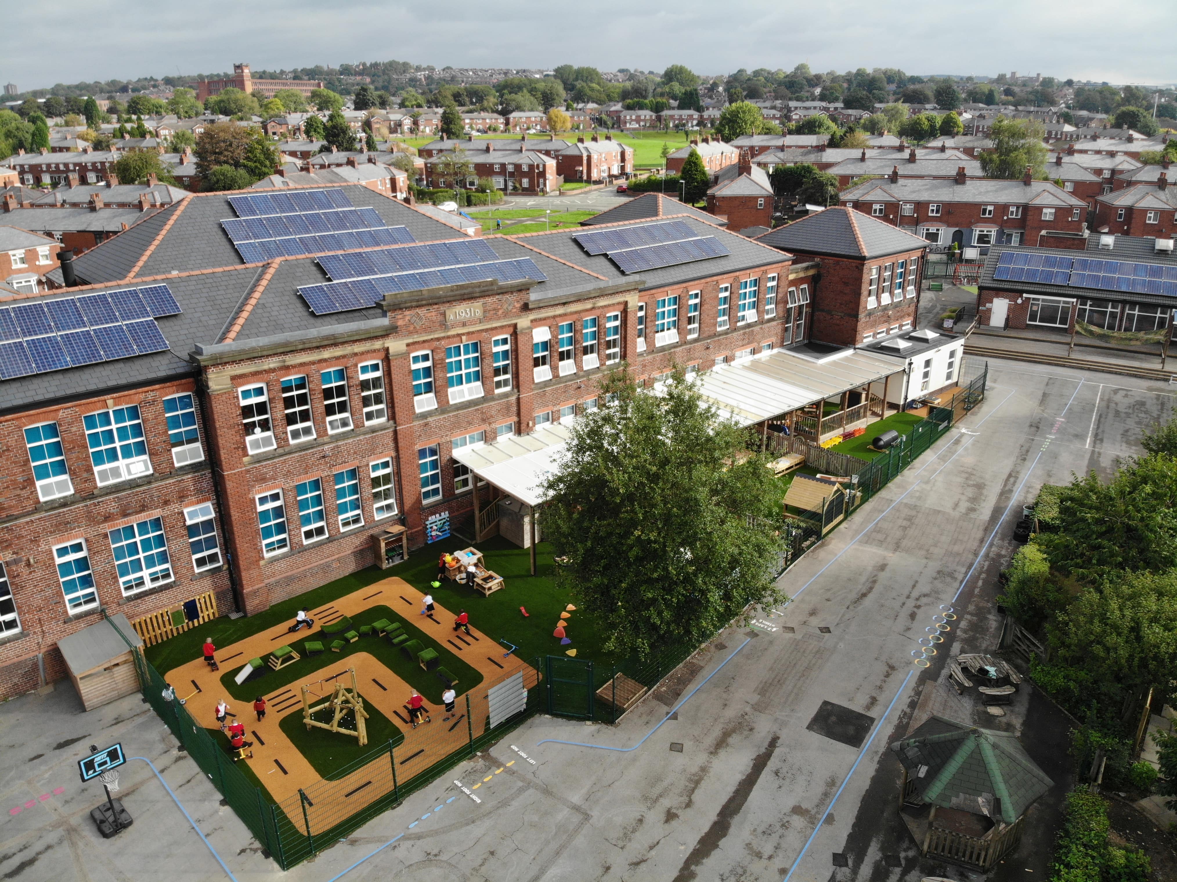 A birds eye view of Oasis Academy Limeside's playground. The EYFS play area and the thermoplastic markings can be seen.