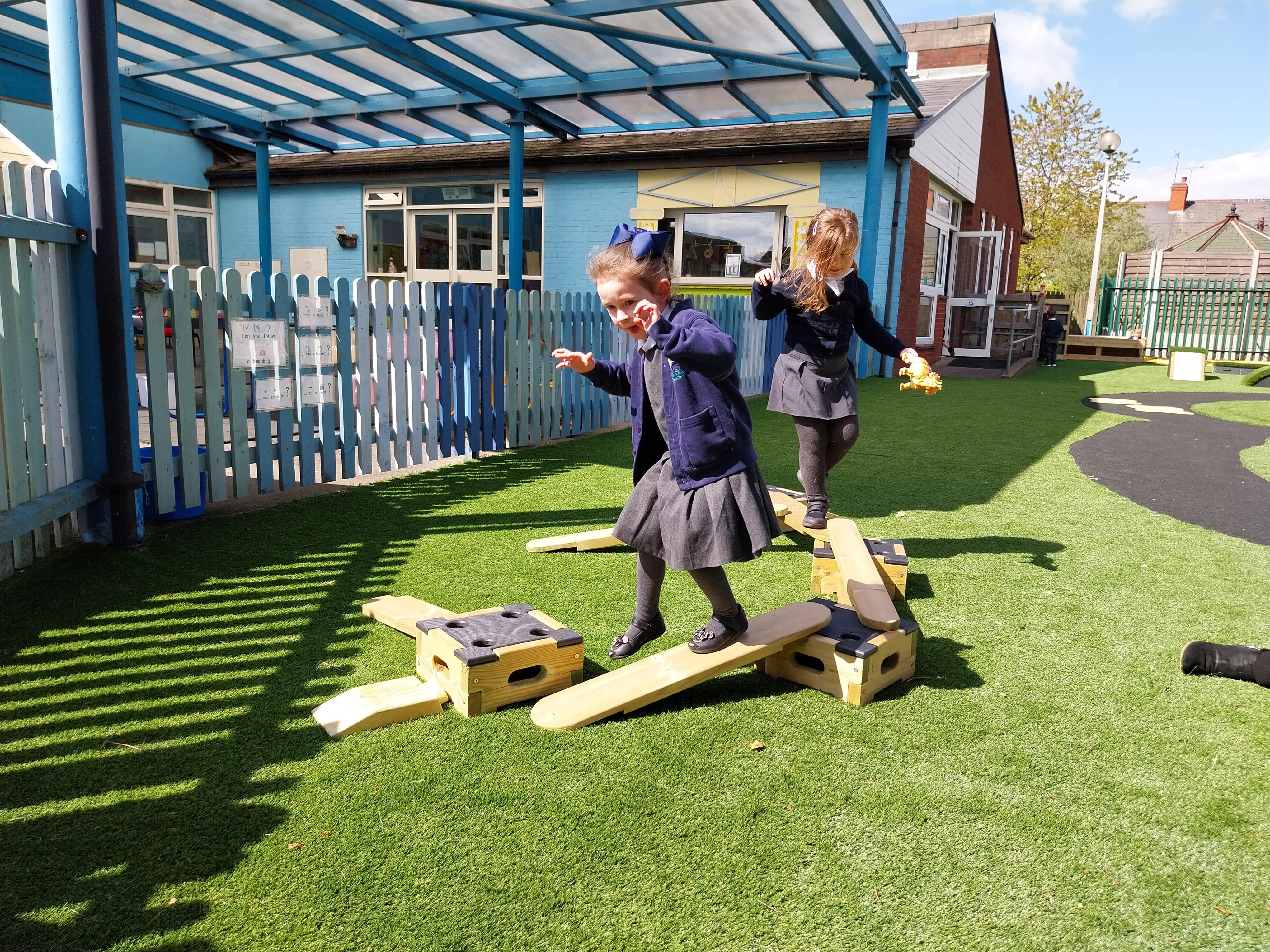 2 SEN girls are working on their self-regulation by completing a circuit created from the Play Builder.