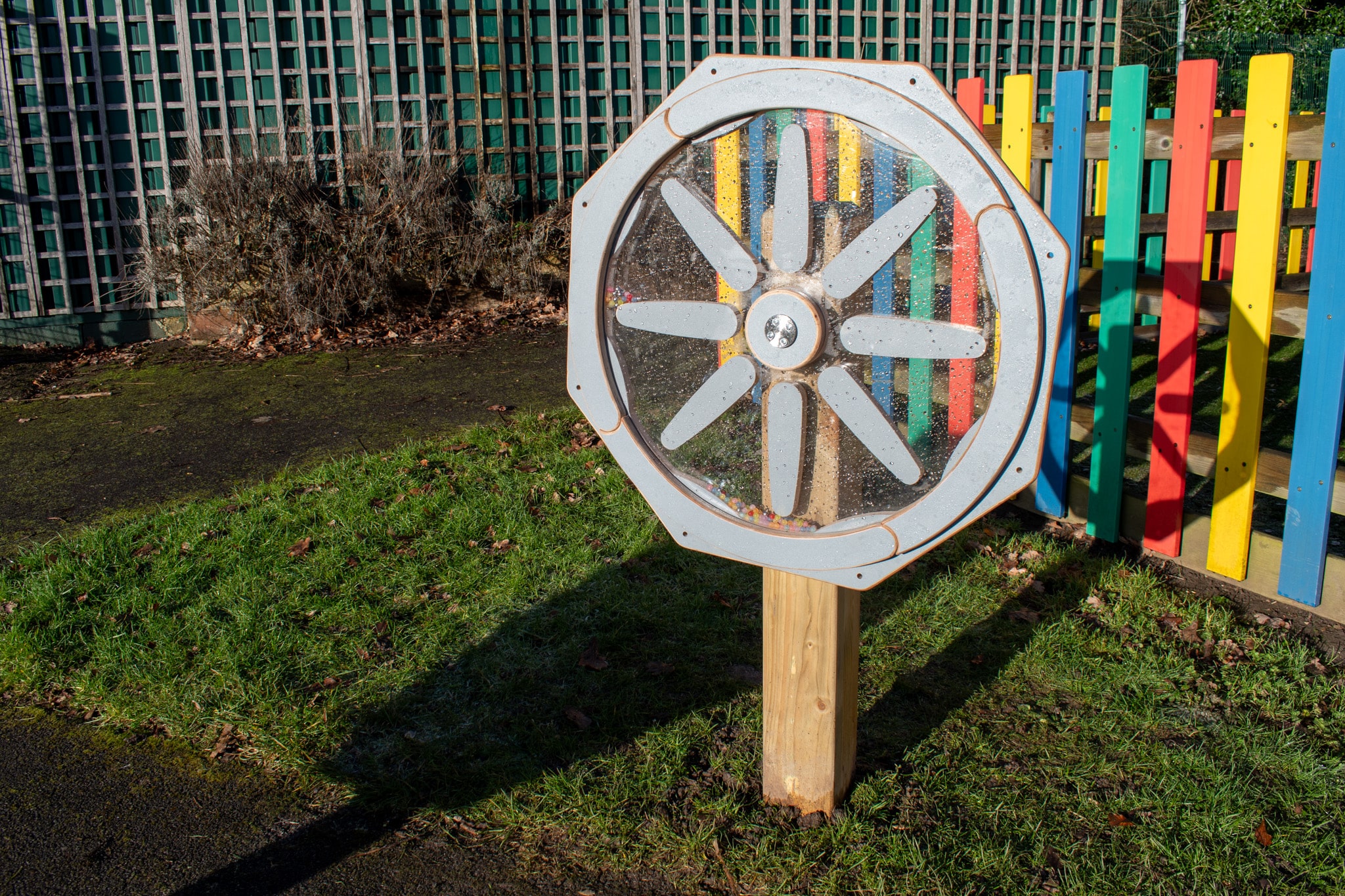 A Sound Sensory Spinner that has been installed in the grass of Springfield School