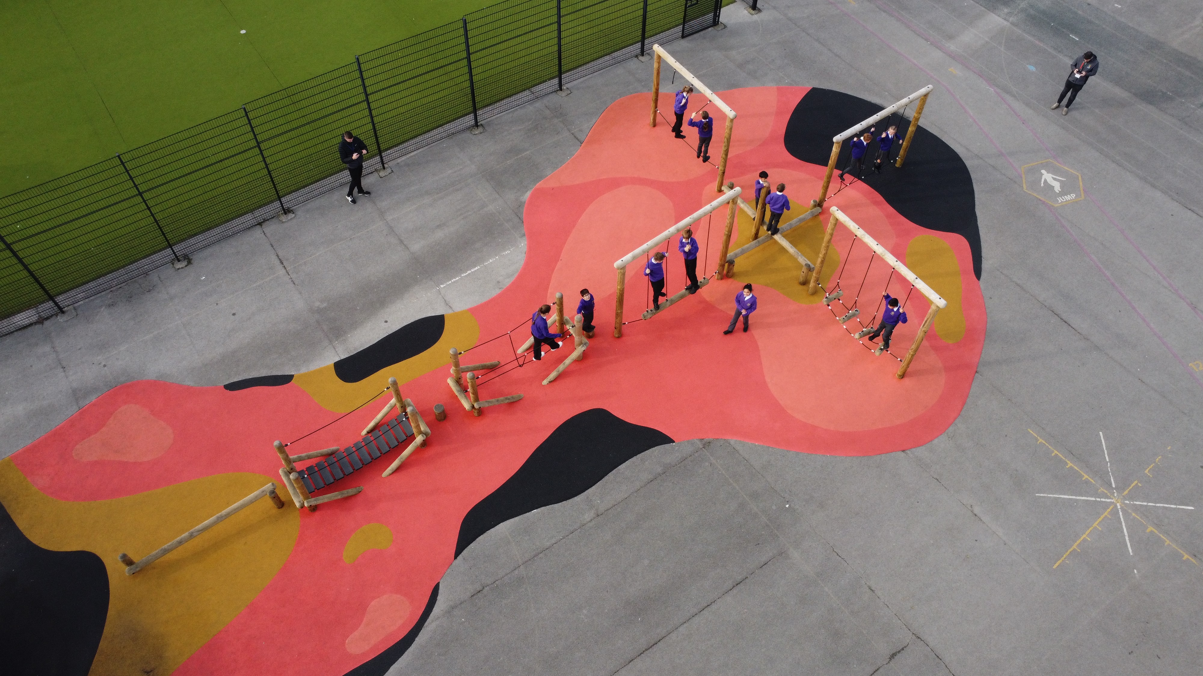 A birdseye view focusing on the trim trail that has been installed on top of the wetpour.