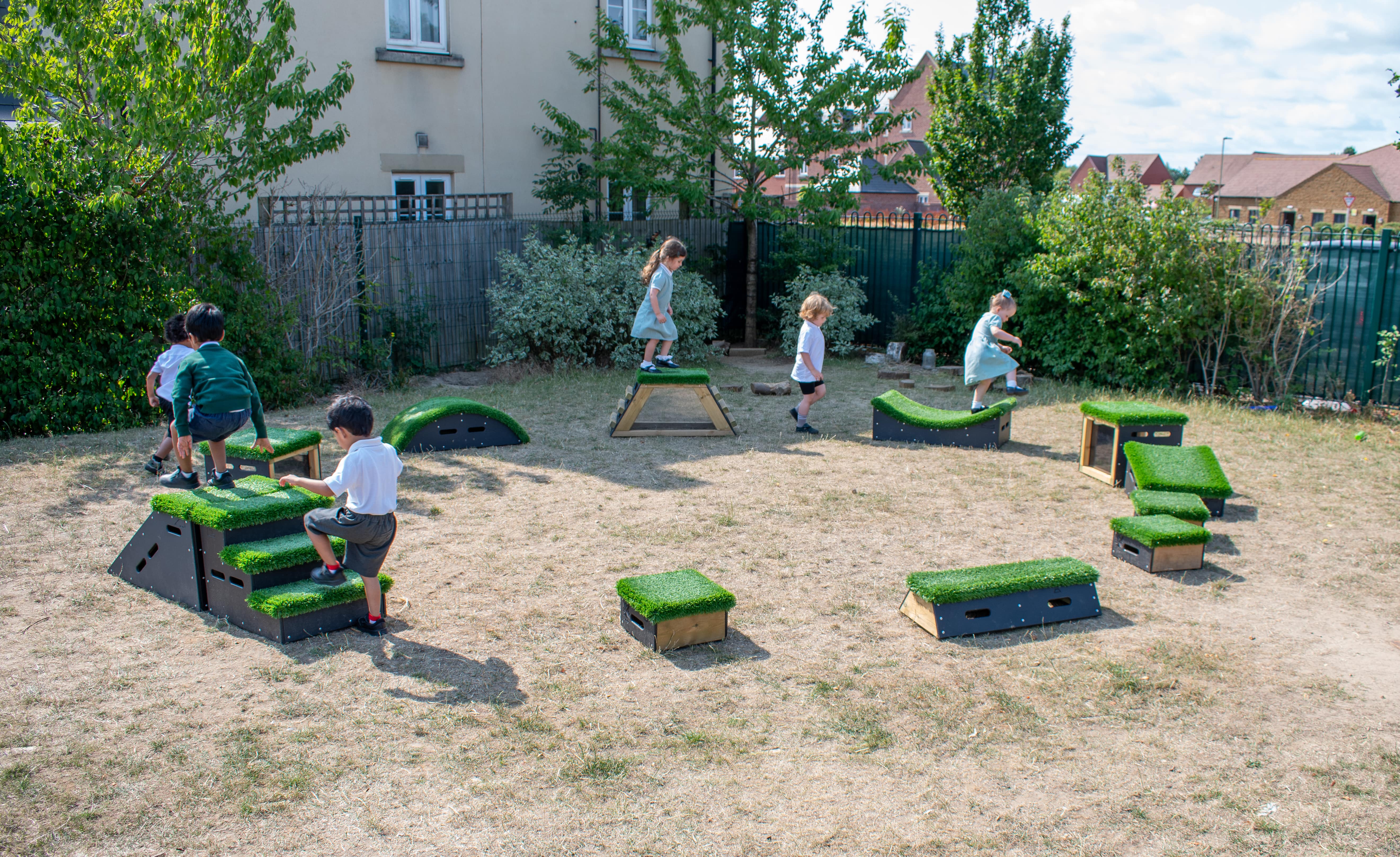 The Sports Premium Epic Explorer Package set up on a grass field for EYFS children to play on.