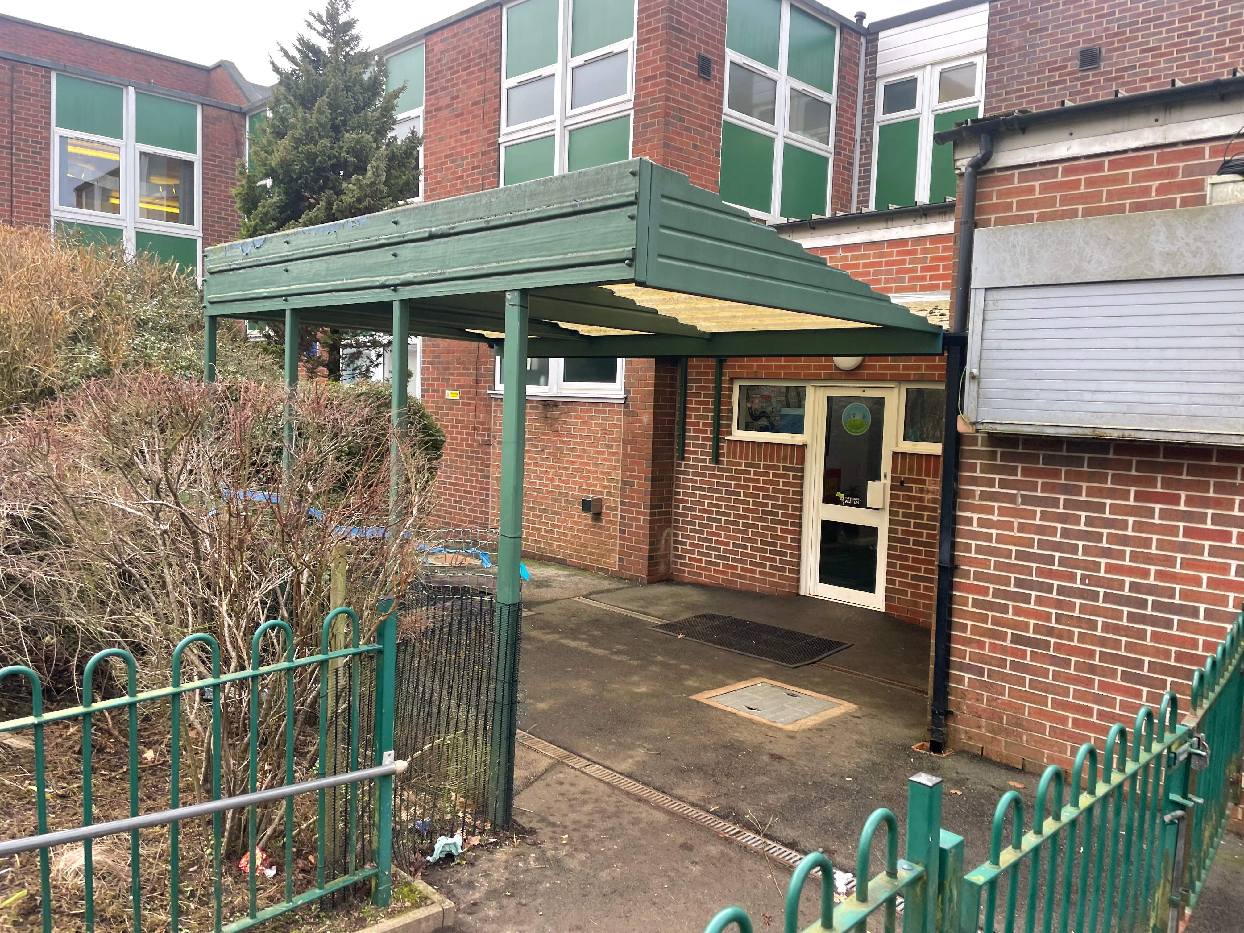 The old outdoor EYFS play area at Park Hall Academy, with a worn-out canopy.