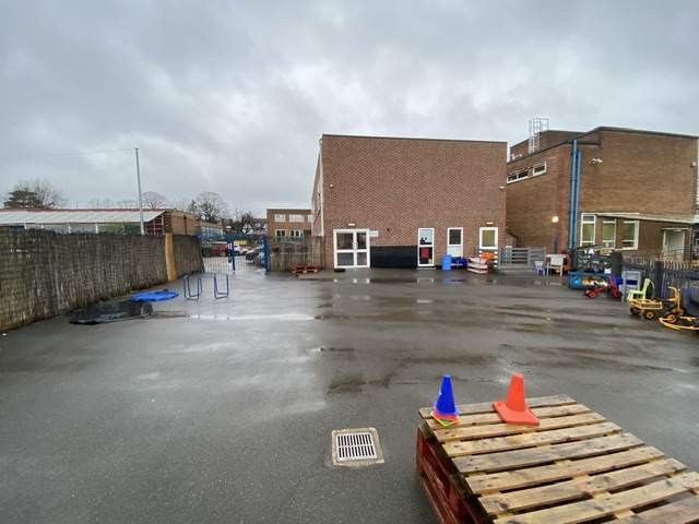 Yenton Primary School's old tarmac playground, with no play equipment present.