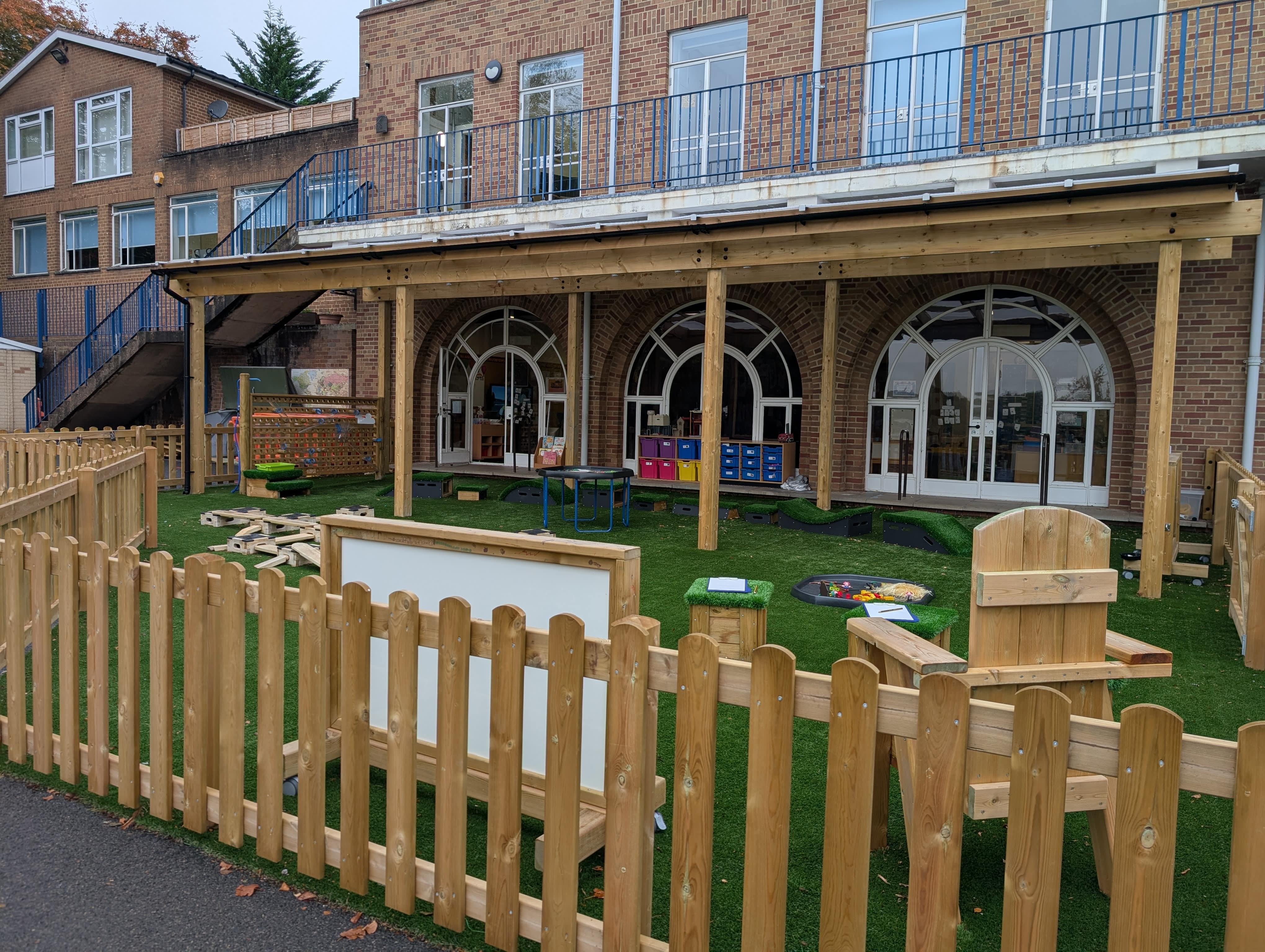 A Bow Top Fence that goes around the EYFS play area.