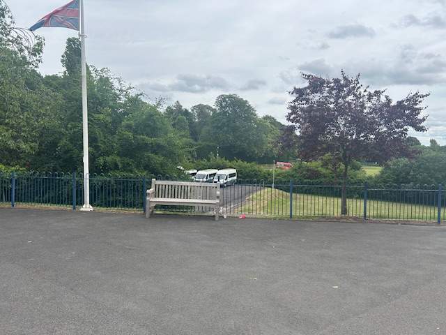 An outdoor shot showcasing the previous tarmac play space before any improvements.
