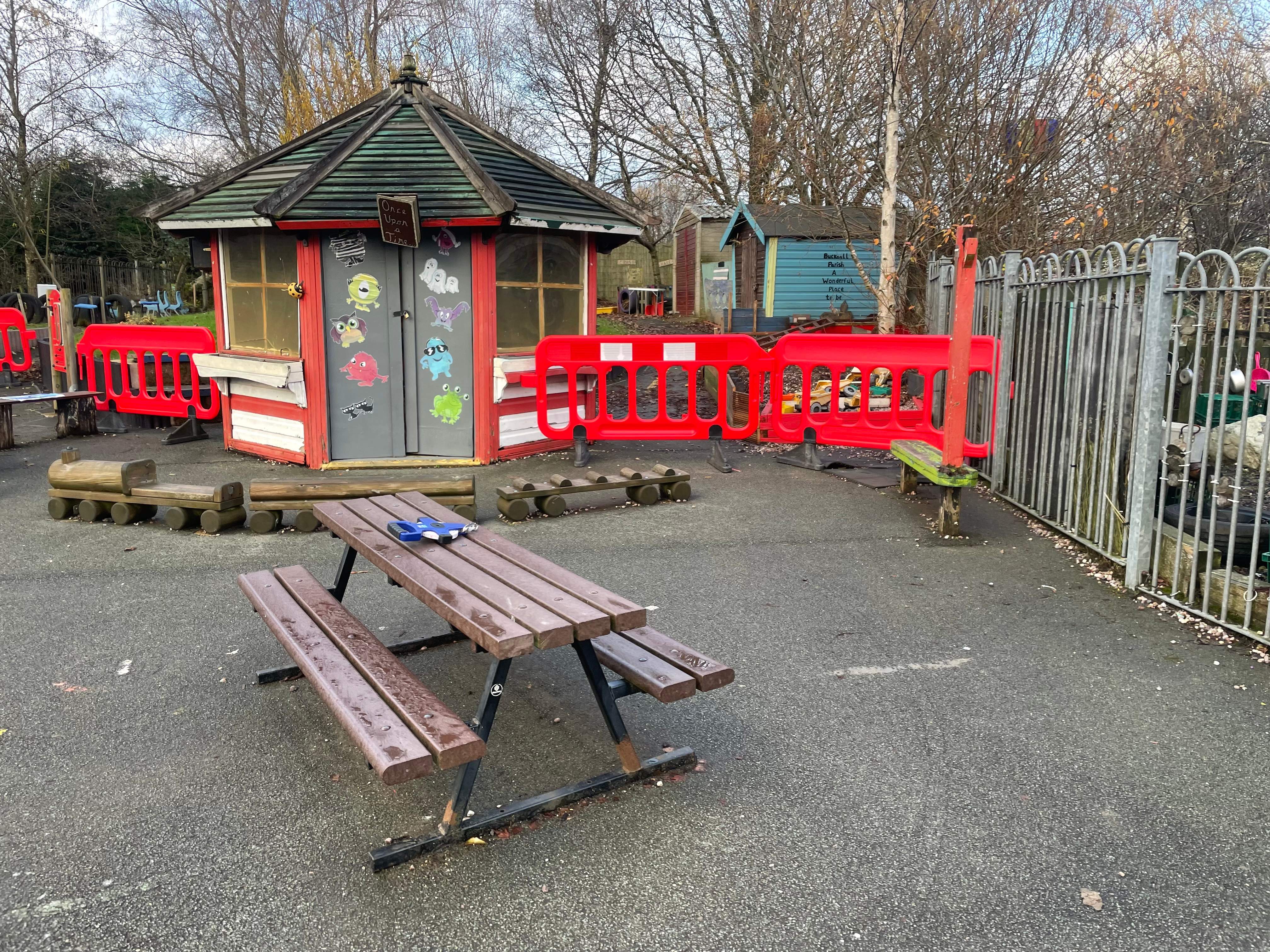 An old playground structure on Kingsland CofE's old playground, on top of old tarmac.