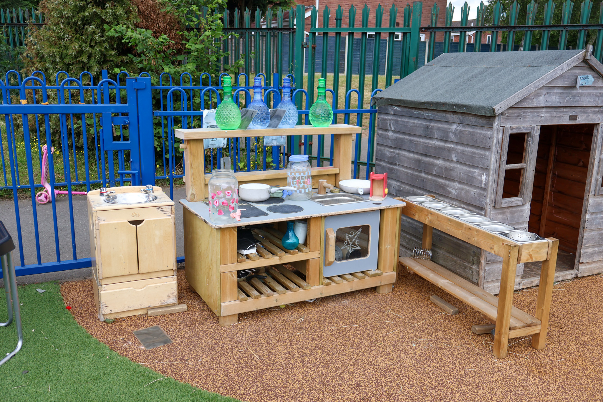 A mud kitchen that has been placed on Wet Pour.